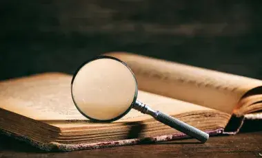 book with a magnifying glass