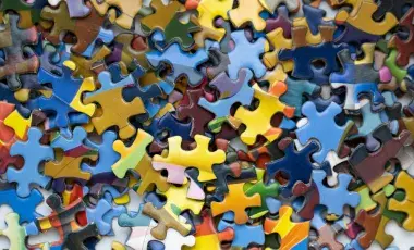 a pile of colorful jigsaw puzzle pieces