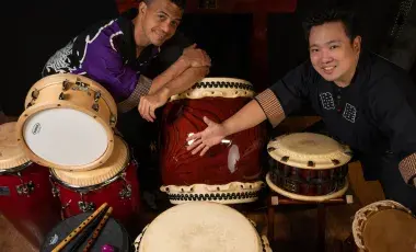 Isaku and his crew showing different kinds of taiko drums