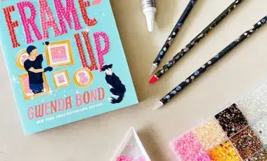 Book with rhinestones, wax pencil, glue, and box of colorful rhinestones