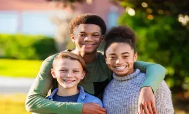 Two young adults and one child