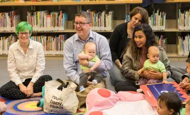 adults and babies at a library storytime