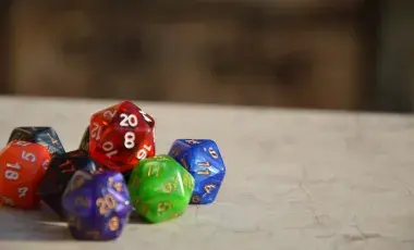 Grouping of orange, purple, red, green, and blue dice.