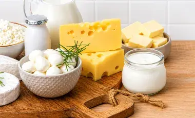 Yogurt, butter and cheese on a table 