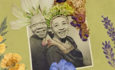 Photograph of couple, adorned with flowers
