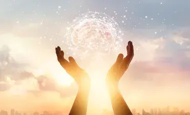 hands raised in the clouds and sun
