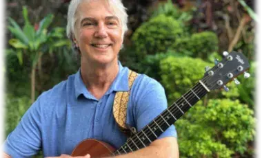 musician Craig Newton holding guitar