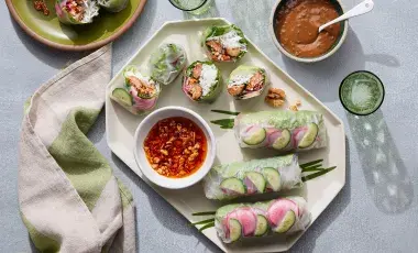 Spring rolls on plate with two dipping sauces