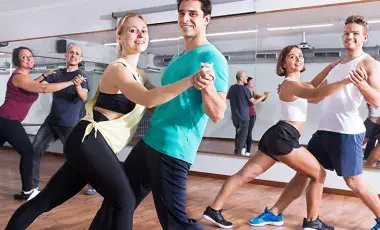 Three couples dancing in a studio