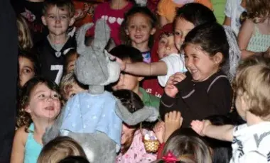 Children watching a puppet show.