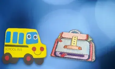 A paper school bus and backpack