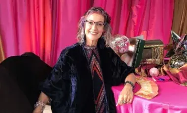 Artist posing at table