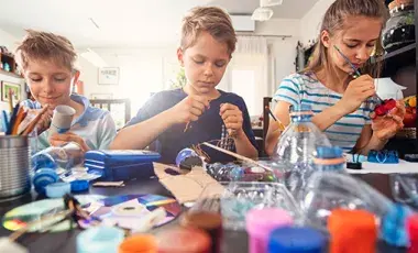 Young people craft with recycled materials