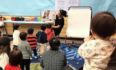 Children looking and listening to a story.