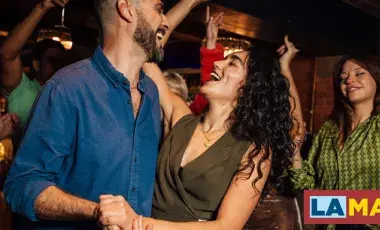 people happily salsa dancing
