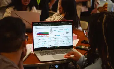 People using a climate simulator program on a computer