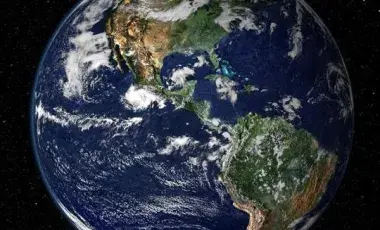 Earth and the moon against a the blackness of space 