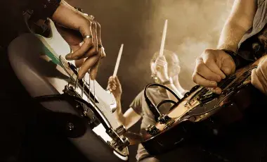 Closeup of a band playing musical instruments and performing live.