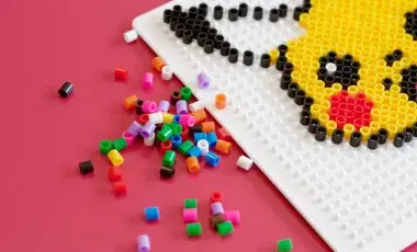 a half finished pikachu is shown on a fuse peg board
