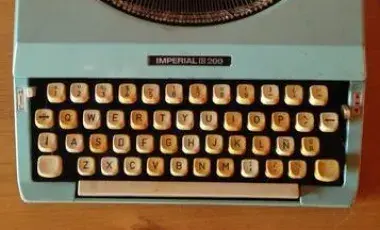 typewriter sits on a desk