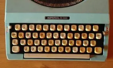 typewriter sits on a desk