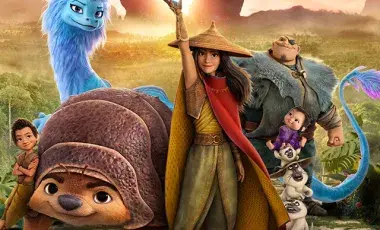 Raya holding a glowing orb near the film's mythical characters