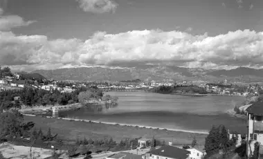 reservoir with mountains and clouds