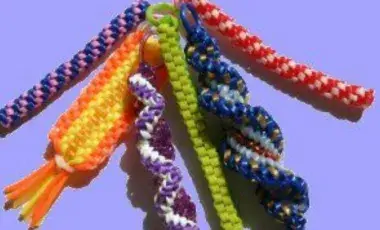 A display of six braided colorful lanyards. 