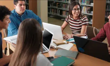 people sitting around table and talking