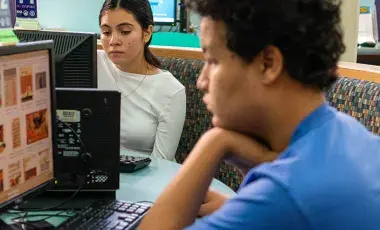 teens studying at computer