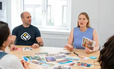 A group of adults sitting at at table and conversing