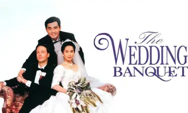 Title card for The Wedding Banquet, a man in a tuxedo stands behind a woman in a bridal gown and another man in a tuxedo. The two men clasp hands.