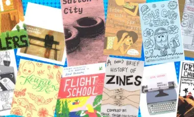 Different colored and sized zines facing up.