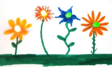 Hand drawn flowers with markers have LED lights with batteries attached to makes the flower centers glow.