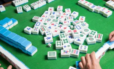 mahjong tiles on felt mat