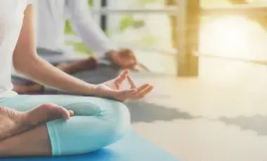 Person in seated yoga position. 