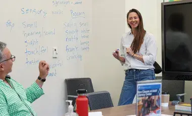 Instructor and students in a classroom.