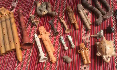 Various Native North American musical instruments on blanket