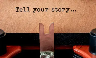 Sign saying "tell your story"