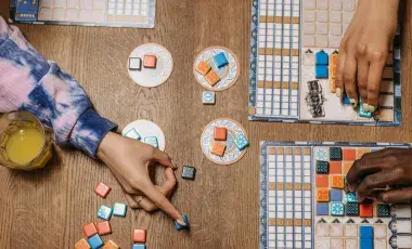 People playing a board game