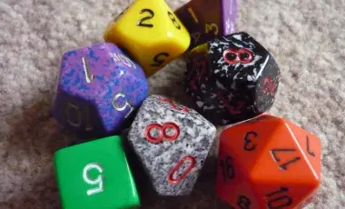 Green, purple, yellow, red, gray, and black dice.