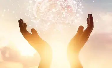 Sunlight through upraised hands.