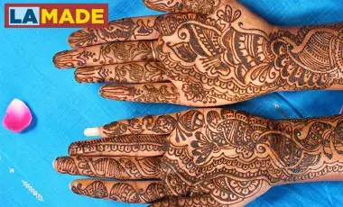 hands decorated in henna