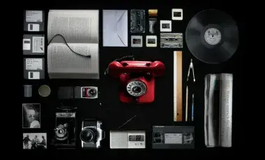 Different types of analog film and video items with a black background.