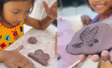 Child plays with clay