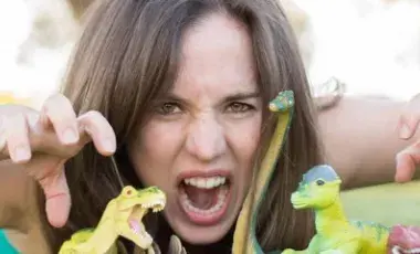 Woman acting out being a dinosaur