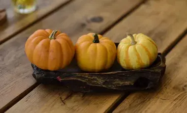 three mini pumpkins