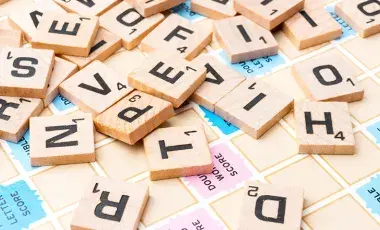 Close up of lettered wooden squares.