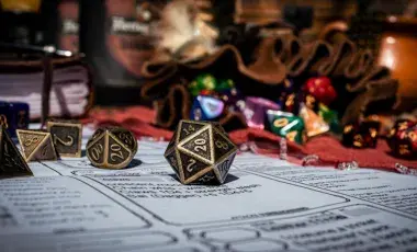 A handful of die cast over a gameboard. 