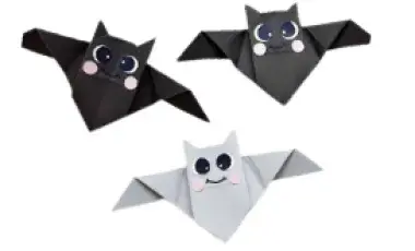 Three paper bats with happy faces